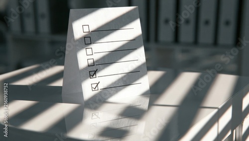 Task checklist on a desk with sunlight and shadow patterns