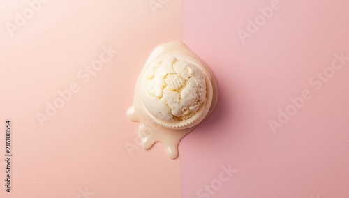 Melting Vanilla Ice Cream Scoop on Pink Background
