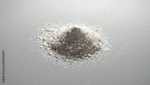 White Granular Substance Piled on a Smooth Surface with Soft Light
