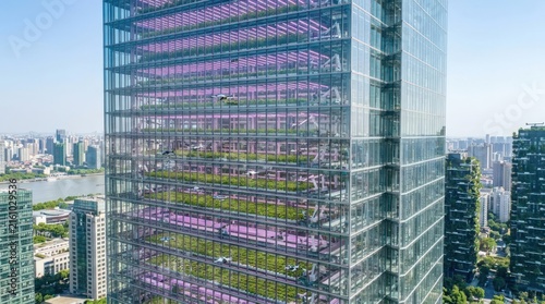 Urban vertical farm integrated into glass skyscraper.