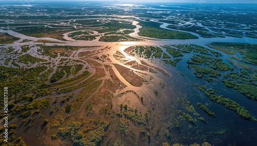 Aerial View of Serpentine Rivers and Lush Green Vegetation at Sunset
