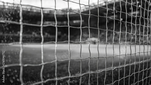 Soccer Goal Net with Blurred Stadium Background in Black and White