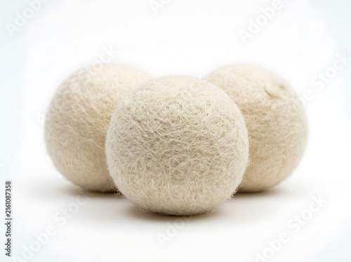 Soft beige knit scrubbing puff balls isolated on white background