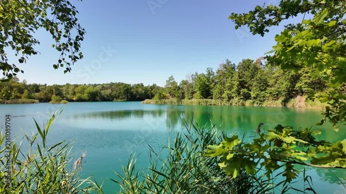 idyllic lake landscape near Pretzien, Saxony-Anhalt, Germany; three former quartzite quarries, deep lake, blue lake, quarry lake, popular diving area 