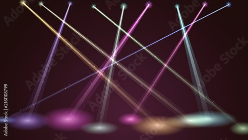 Dramatic stage spotlights shining colorful beams of light down creating an energetic concert atmosphere with spotlight illumination performance colorful multicolored background lighting