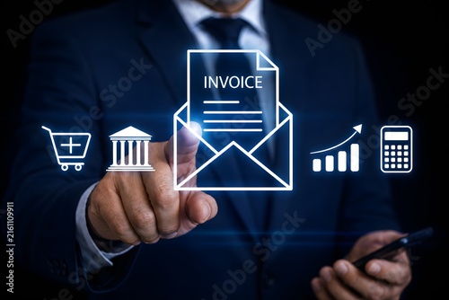 Businessman interact with digital invoice icons on virtual screen. Managing online invoices, electronic tax, e-invoice, and digital receipt statements concept