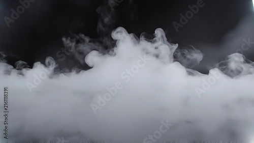 Thick white smoke or fog swirling over a dark background with mysterious atmospheric effect