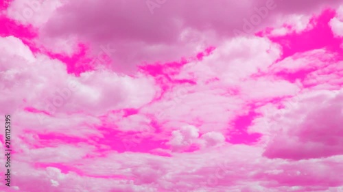 A stunning, highly saturated pink sky fills the frame with dramatic, voluminous clouds. This ethereal backdrop evokes feelings of dreaminess and fantasy. Perfect for romantic or vibrant design project