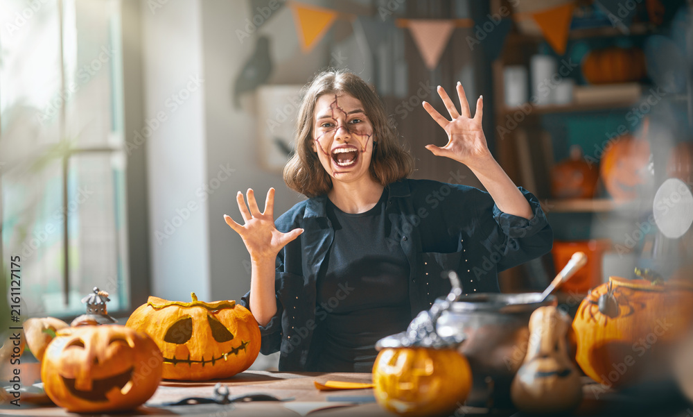 Naklejka premium Joyful Woman with Halloween Face Paint