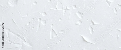 Close-up of subtly textured white paper, showing fibrous detail,  macro,  paper texture