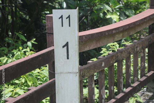 Konstfotografi Kilometer marker post on a path