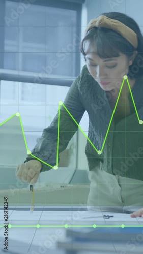 Animation of financial data processing over asian businesswoman working at office