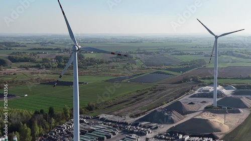 Hybrid wind turbine and solar panel field for clean energy production