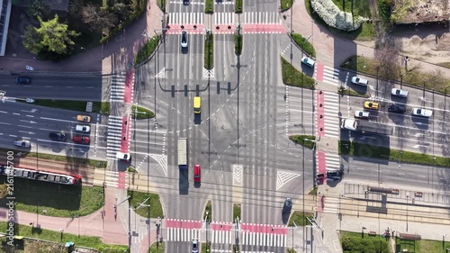 Modern urban intersection with road markings and vehicles
