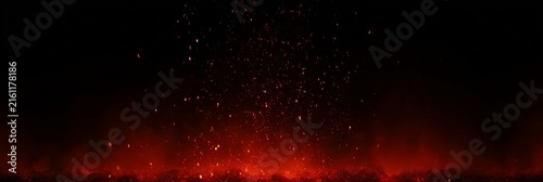 Fire Embers and Sparks Over a Black Background with Abstract Dark Glitter Particle Lights and Motion-Blurred Bonfire Effect, Banner