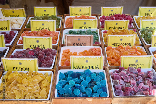 Colorful fruit flavored candies in a market stall display