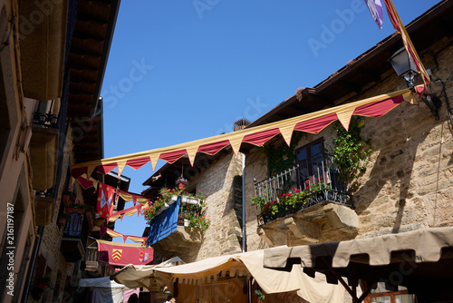 Puebla de Sanabria old town street decorated with medieval festival banners