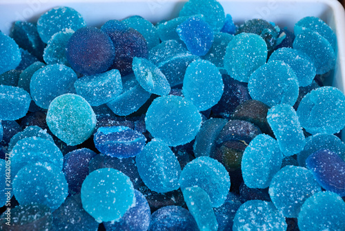 Blue sugar coated gummy candies filling the frame