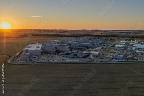 Фотография Aerial drone view of Umicore battery materials production plant in Radzikowice near Nysa, Poland, surrounded by agricultural fields