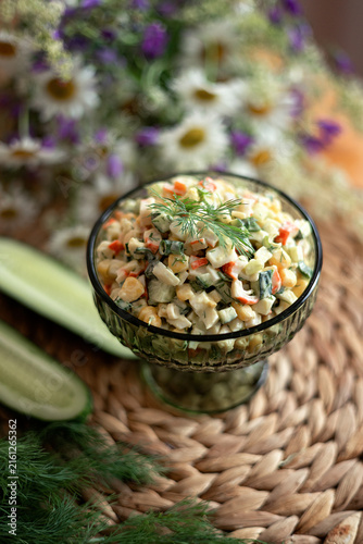 A photo of crab salad with cucumber.