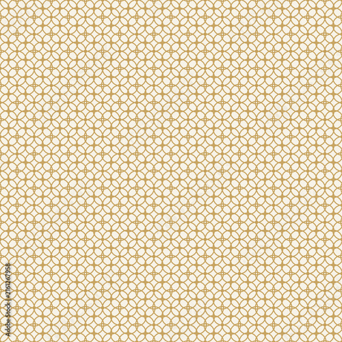 Golden quatrefoil pattern on beige background, seamless texture