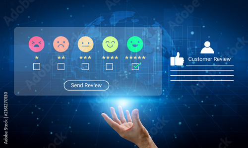 Cuadro en lienzo A hand reaching out to a digital rating system showcasing various emotive feedback symbols on a tech-inspired background, ideal for representations of customer service and engagement