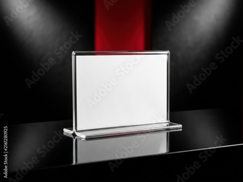 Clear Acrylic Tabletop Display Sign On A Dark Reflective Surface