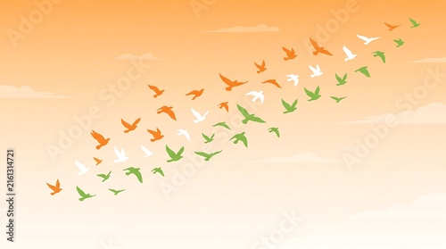 Tapety artystyczne Flock of birds in Indian flag colors flying in the sky representing national pride