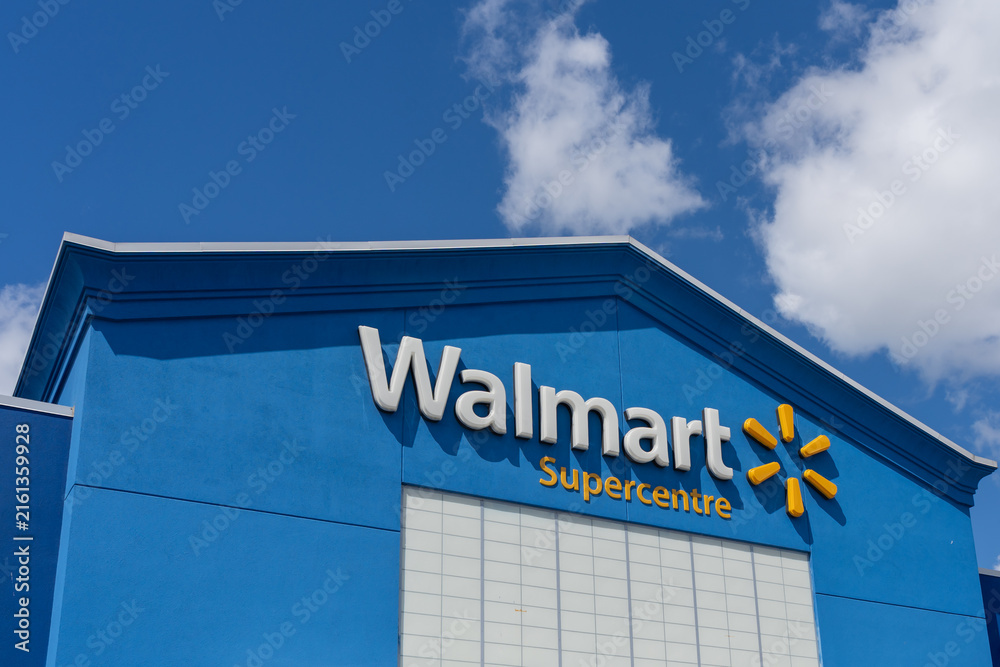 Obraz premium Toronto, ON, Canada - August 17, 2026: Closeup of the Walmart Supercentre retail store on the exterior blue facade. Toronto, ON, Canada. 