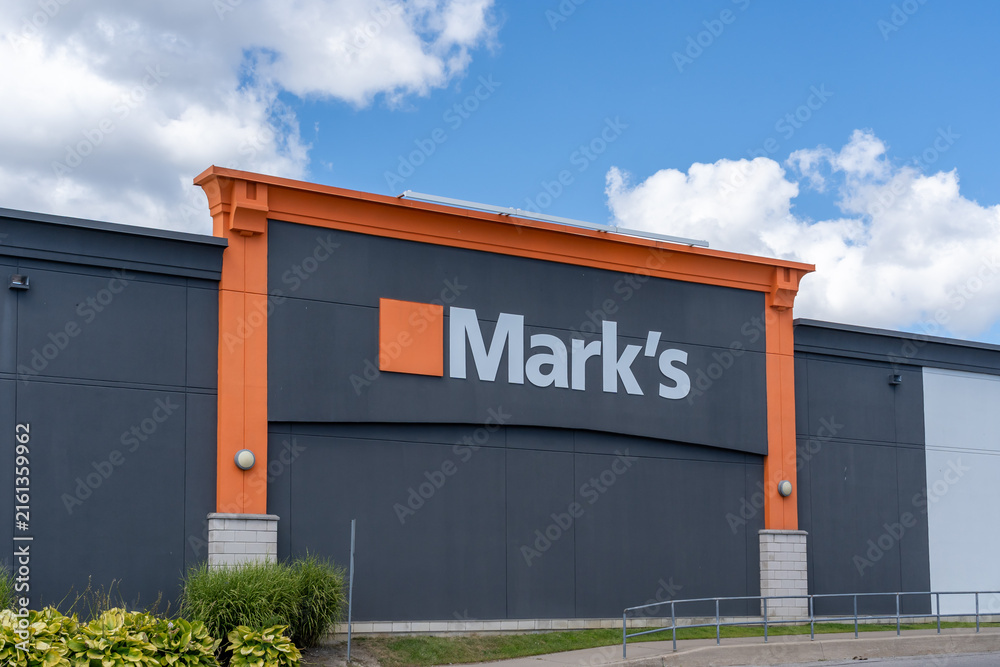 Fototapeta premium Toronto, ON, Canada - August 17, 2026: Mark's store sign on the building in Toronto, ON, Canada. Mark's ((formerly known as Mark's Work Wearhouse) is a Canadian clothing and footwear retailer. 