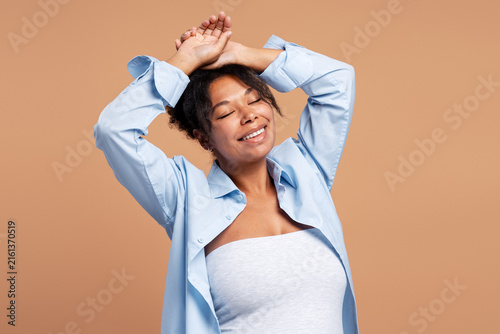 Принти на полотні African American woman feeling happy and relaxed with eyes closed