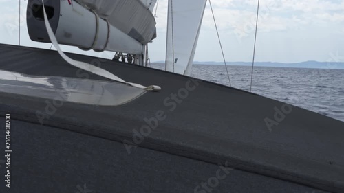 Sailing yacht navigating the calm ocean waters