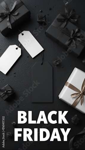 Elegant gift boxes and empty tags on textured black surface for Black Friday promotion