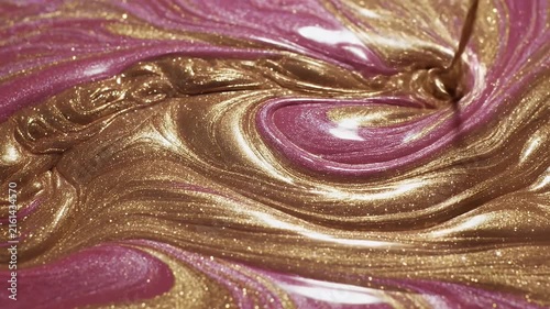 Close-Up View of Pink, Purple, and Gold Marble Swirl Abstract Art Surface