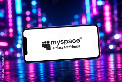 In this photo illustration, a smartphone displaying the Myspace App logo is photographed against a vibrant neon-lit background, in India on 18 August 2026.