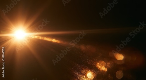 Bright, warm light flares and bokeh particles emanate from a luminous source