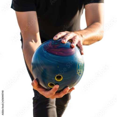Close-up of a bowler holding a colorful bowling ball before a game.