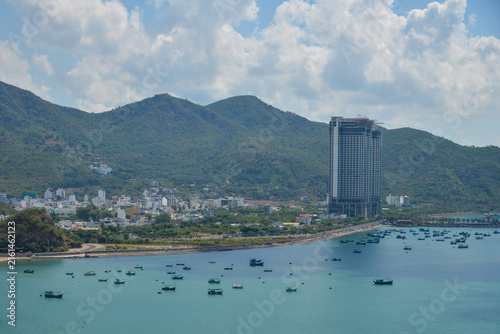 NHA TRANG, VIETNAM – MAY 10, 2026: Aerial view of North Nha Trang coastline with Nha Trang Bay, beachfront road, buildings and mountains.