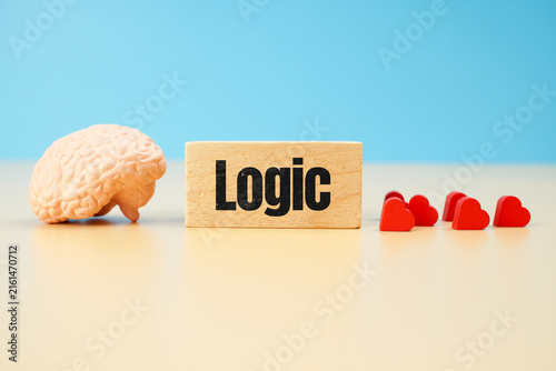Quadro su tela Logic concept with human brain model and red hearts on blue background, representing rational thinking, reasoning, emotional intelligence, decision making and psychology
