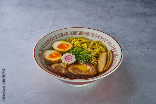 Japanese ramen bowl with noodles, chashu pork, and egg