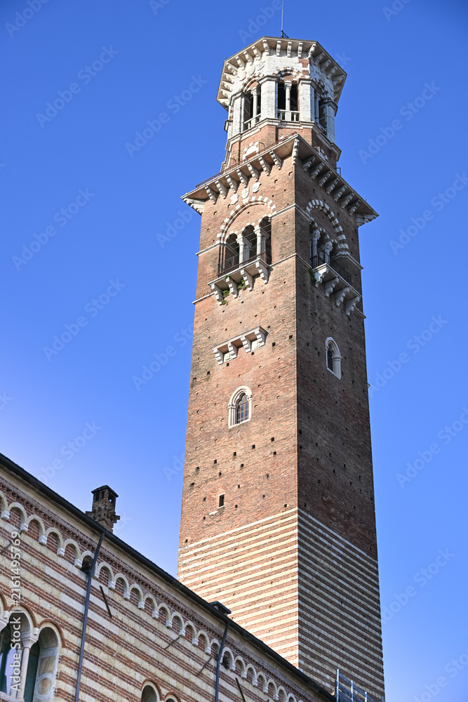 Fototapeta premium Torre dei Lamberti rising above historic Verona against blue sky