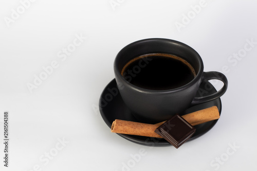 Black Coffee with Cinnamon and Dark Chocolate on White