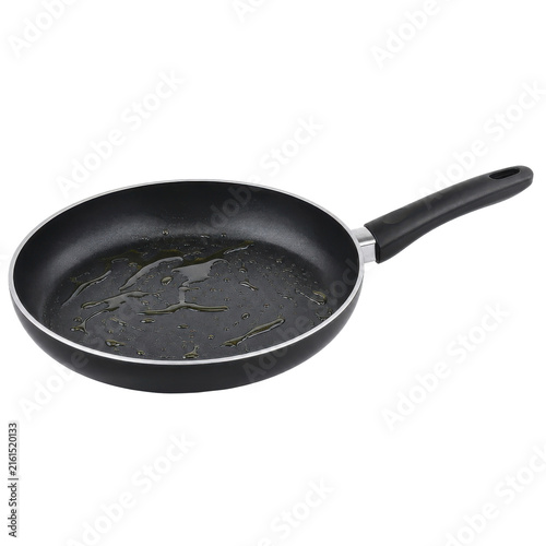 Fotografía Black non-stick frying pan with a plastic handle contains cooking oil droplets,