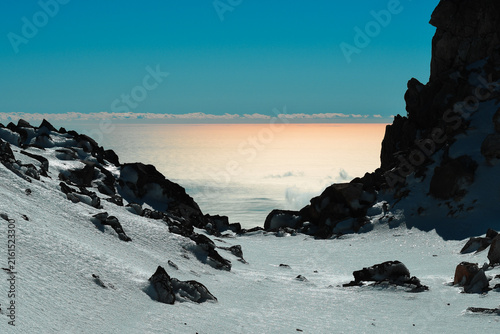Принти на полотні Snow-covered slopes of Mount Taranaki overlooking the Tasman Sea, New Zealand