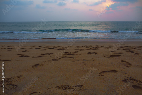 Photography An Evening at a peaceful beach with ocean waves and sandy shore