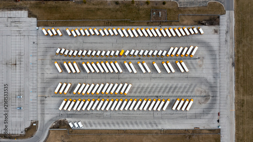 Large school bus depot with long parallel parking rows