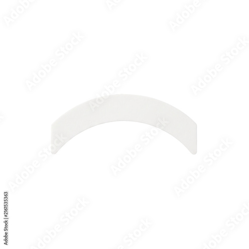 Fotografie Single white curved strip for cosmetic eyelid enhancement or medical tape