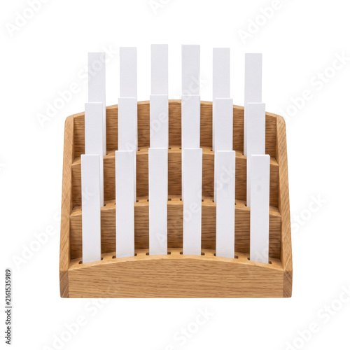 Fotografie Wooden rack holding multiple white paper scent testing strips for fragrance eval