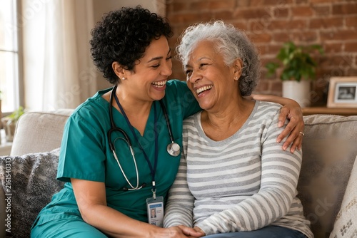 Smiling nurse embracing happy senior woman on couch at home