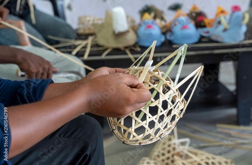 Artisan weaves a bamboo frame for a traditional mask of Majuli in a traditional mask-making workshop